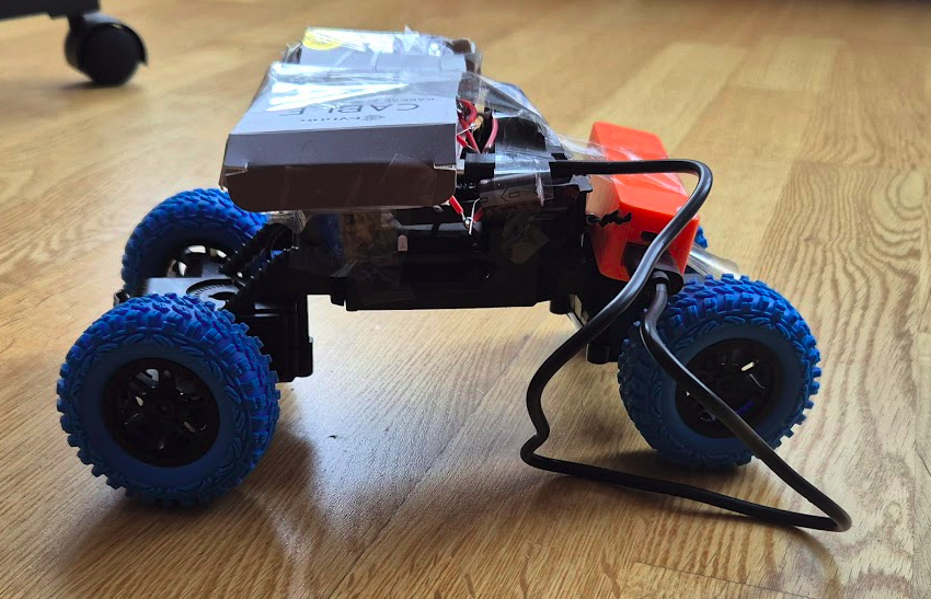 Side profile view of the Carigy RC car