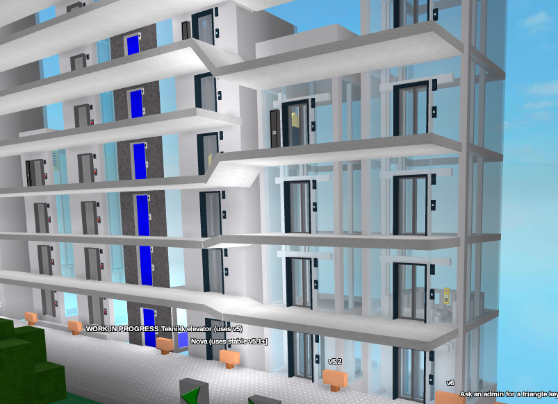 Far-away shot of several elevators at a testing facility